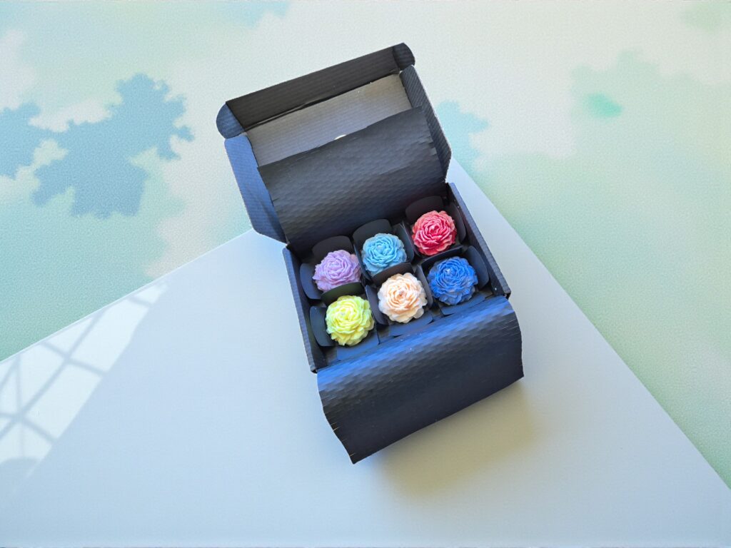 Luxury gift box of floral-shaped peony candles, perfect for wedding favours or gifts